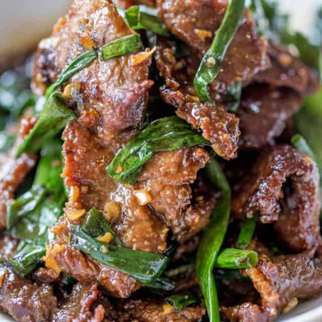 Mongolian style Beef piled high in white bowl