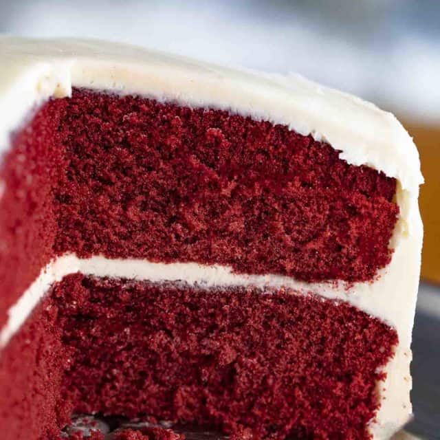 red colored cake with frosting