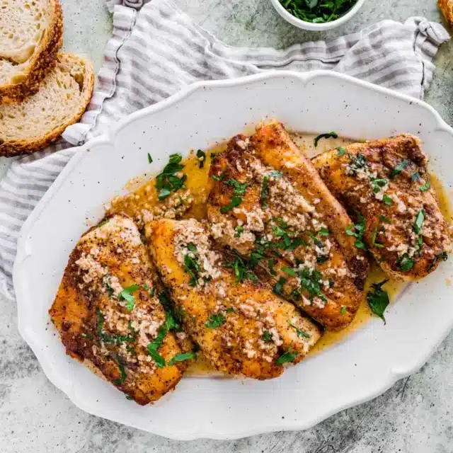 Serving plate with fried fish fillets.